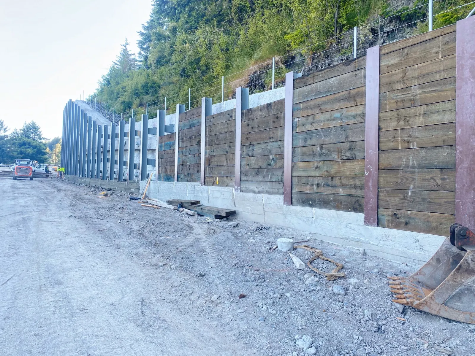 Soldier pile wall with timber lagging and steel beams